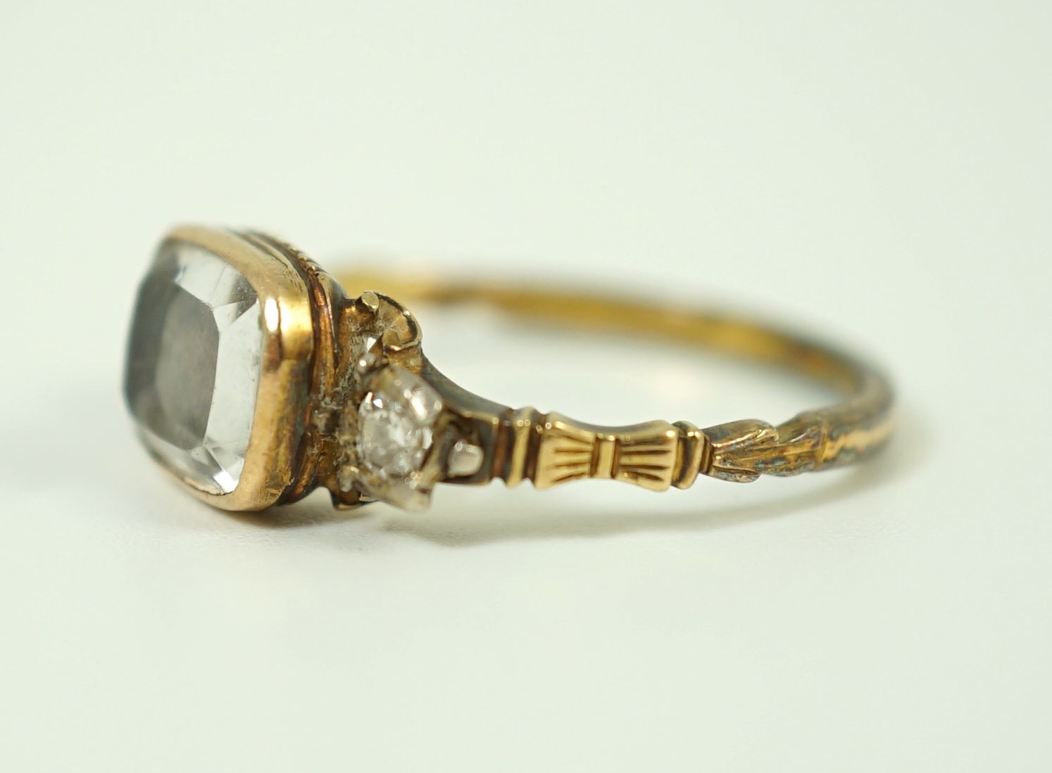 An 18th century gold and rock crystal and diamond set mourning ring